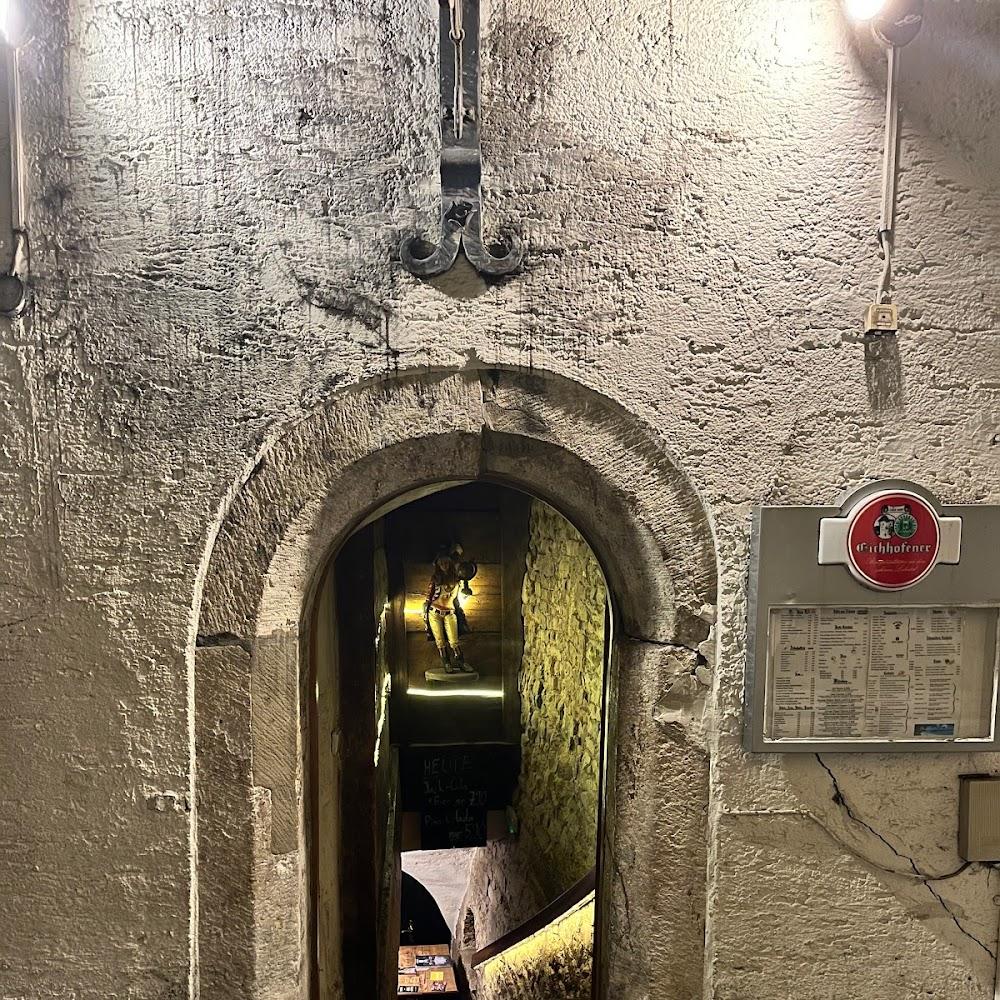 Stone archway with a sign for